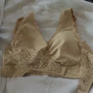 Beige wrap around bra has slight padding, but has no wires, lace wraps, 15”